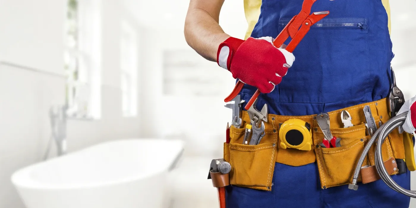 The torso of plumbing technician showing a tool belt from Plumbing Lake Travis in Leander, TX - Leander TX The torso of plumbing technician showing a tool belt from Plumbing Lake Travis in Leander, TX - Leander TX