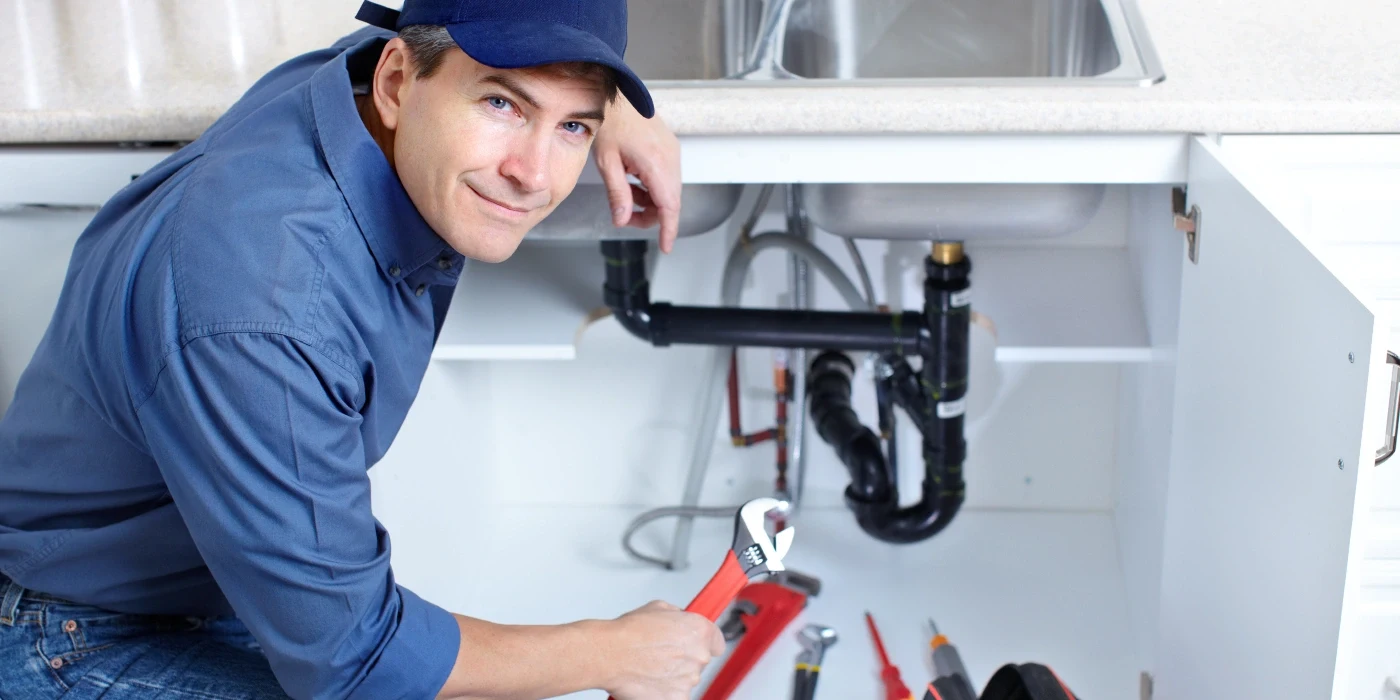 a plumber technician with a tool belt from Plumbing Lake Travis in Austin, TX - Residential plumbing services a plumber technician with a tool belt from Plumbing Lake Travis in Austin, TX - Residential plumbing services